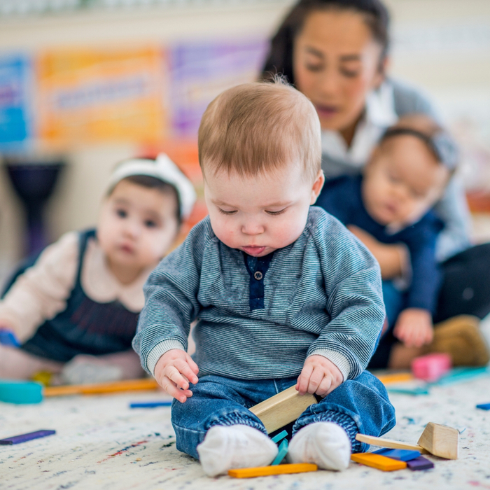 Baby playing with a block