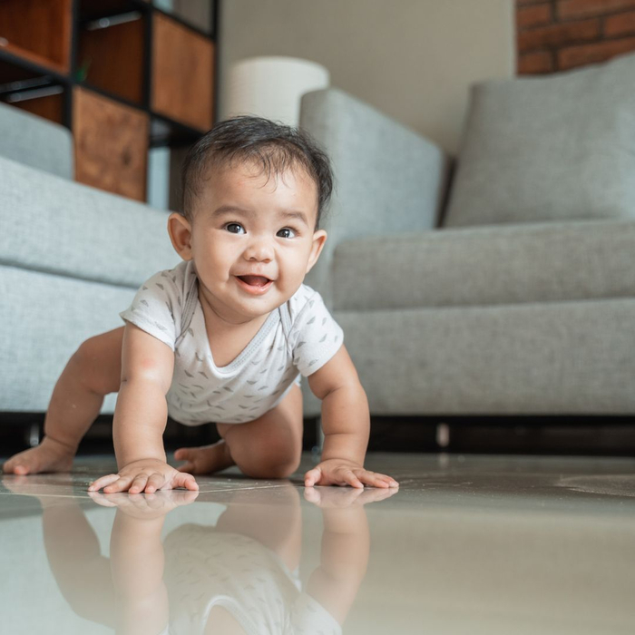 infant boy crawling