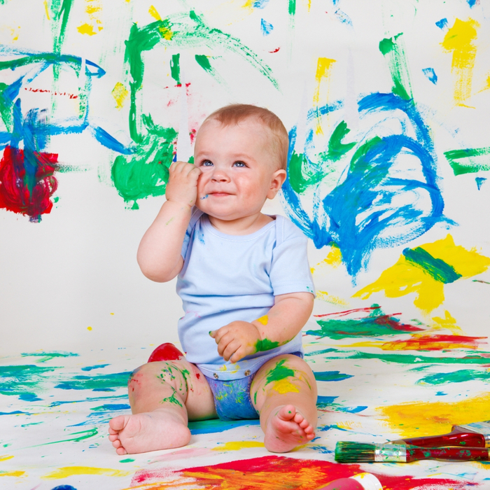 Baby covered in paint