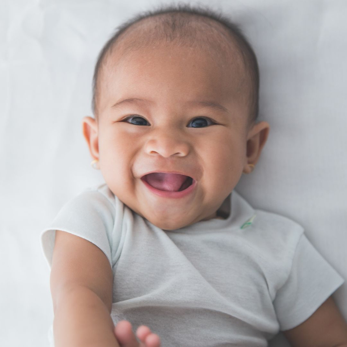 infant boy smiling