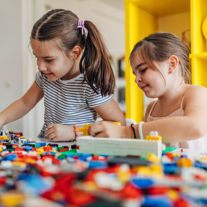 girls playing with lego