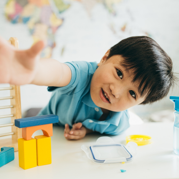 Toddler reaching out