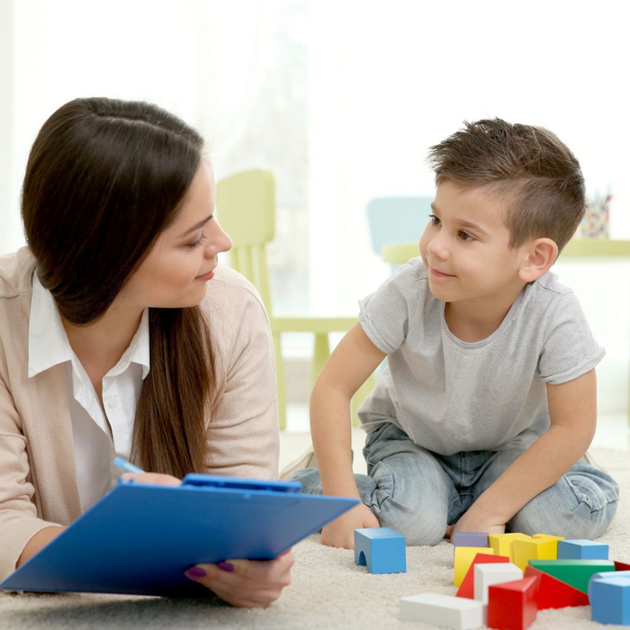 woman talking with young boy