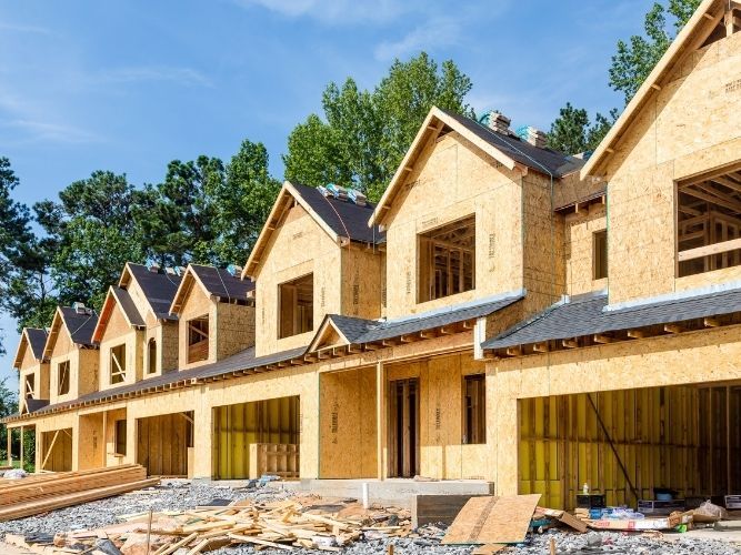 new construction townhomes being roofed new construction townhomes being roofed