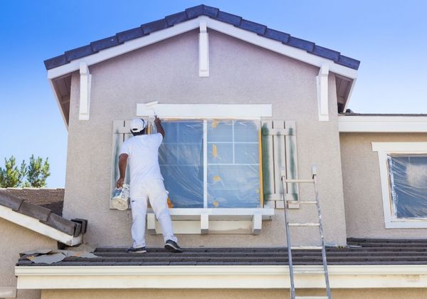 contractor painting house trim