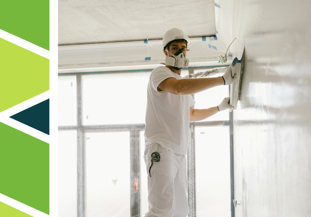 Contractor finishing new drywall and sheetrock.