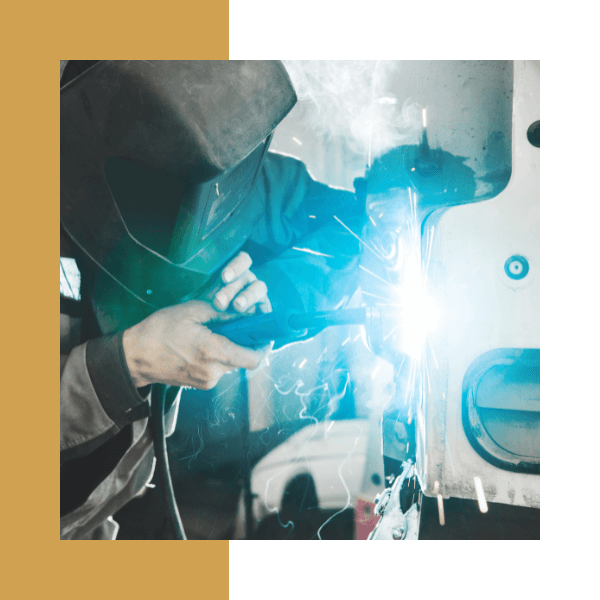 a person in safety gear welding