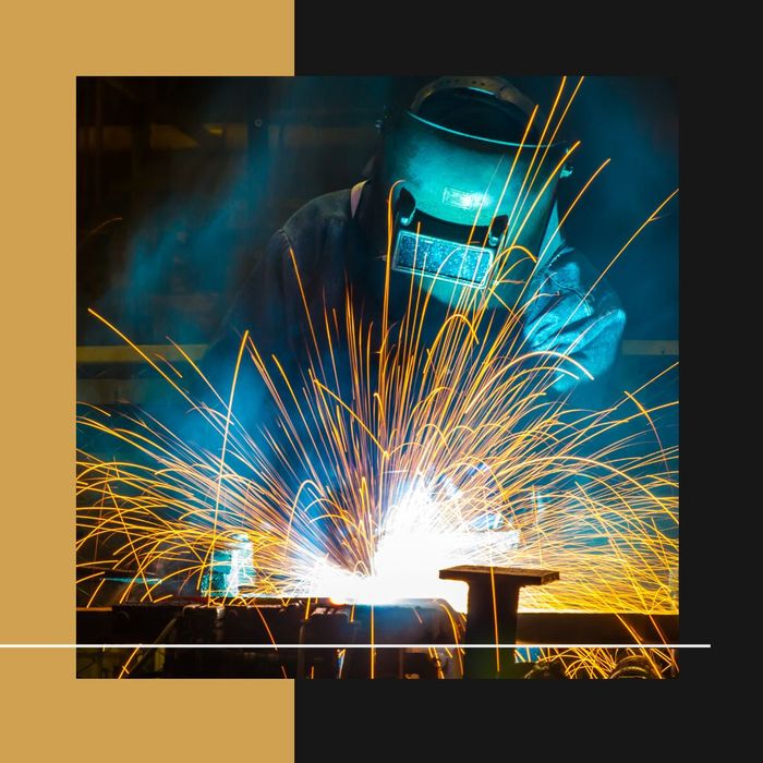 Person welding with sparks flying