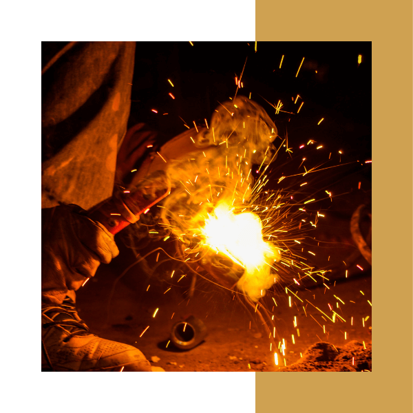 a person in safety gear welding