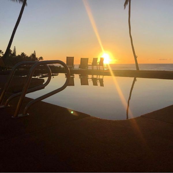 pool with a sunset in the background