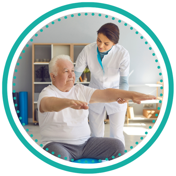 Rehabilitation professional working with patient on exercise ball. 