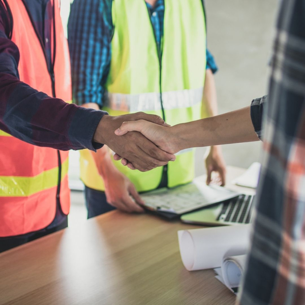 shaking hands with home contractors