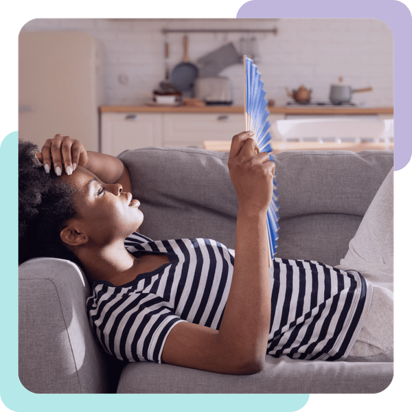 woman lays on couch with fan Santa Cruz 3.png
