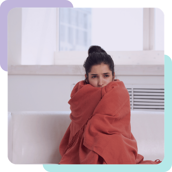 woman wrapped in blanket on couch Hollister 2.png