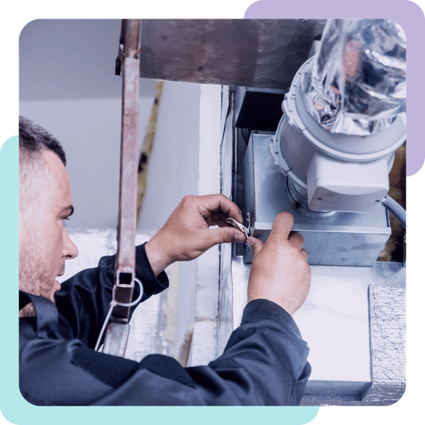 HVAC tech works on system with ducting visible Hollister 1.png