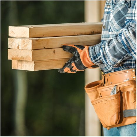 contractor holding wood