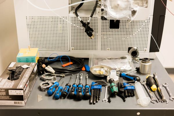 Collection of chromatography refurbishing tools on a metal table