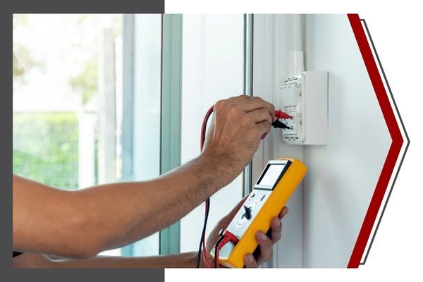 electrician testing outlet