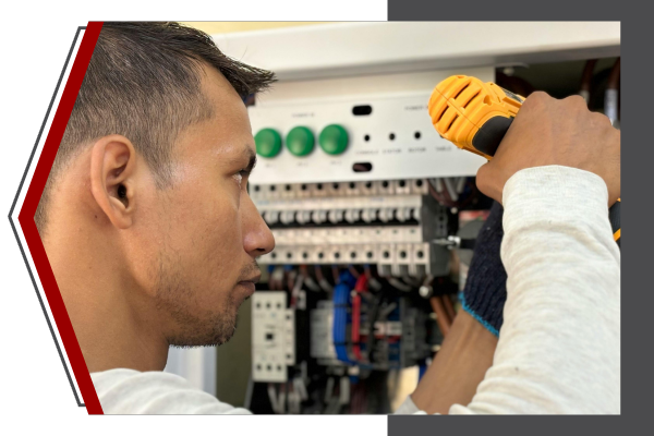 man working on electrical panel