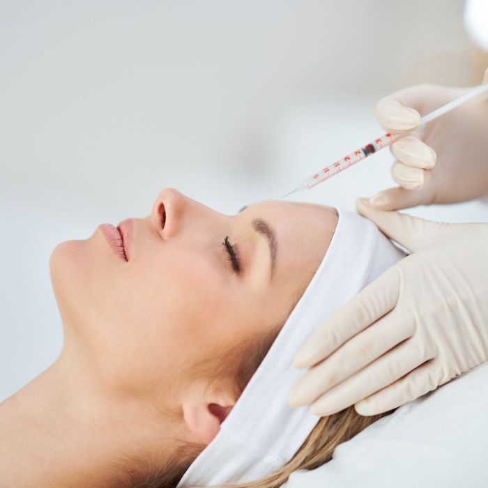 woman receiving facial injections