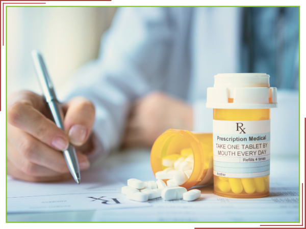 Pharmacist helping with prescription transfers. Pharmacist helping with prescription transfers.