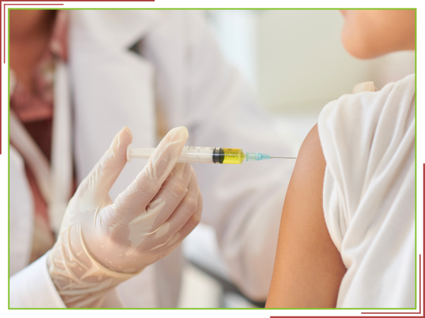 Getting a flu shot or immunization at the pharmacy.