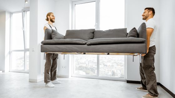 Movers lifting a couch