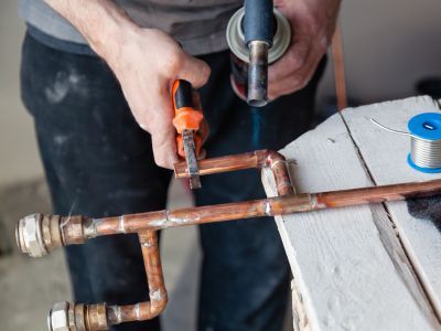 New plumbing pipes being installed in a residential setting. New plumbing pipes being installed in a residential setting.