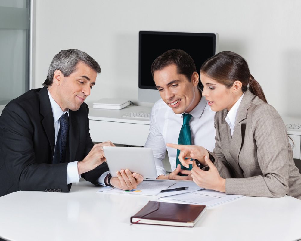 lawyer going over taxes with a couple in his office