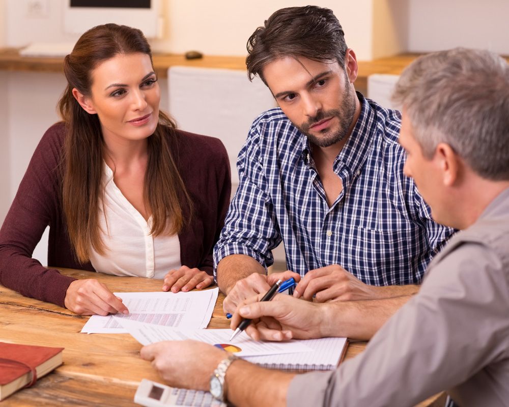 man and women discuss taxes with lawyer