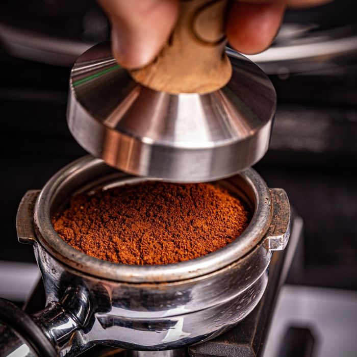 Pressing Coffee Grounds 