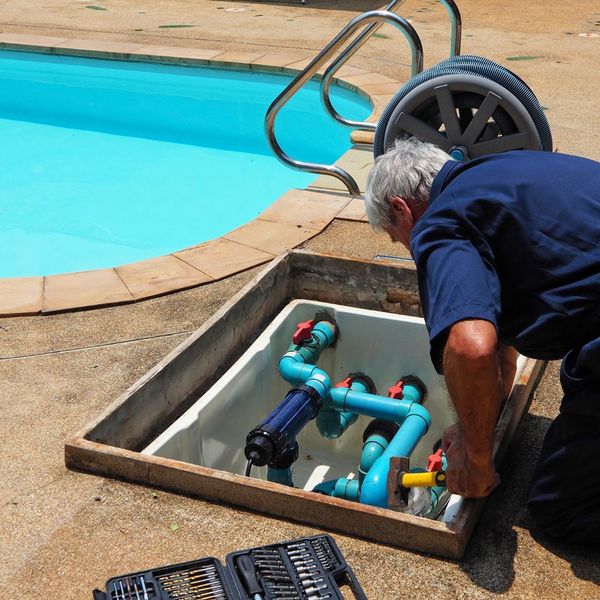 man conducting pool repair