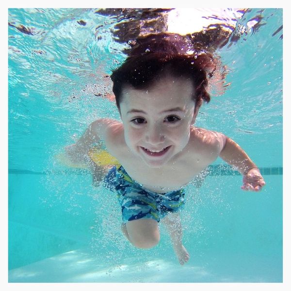 kid swimming in pool