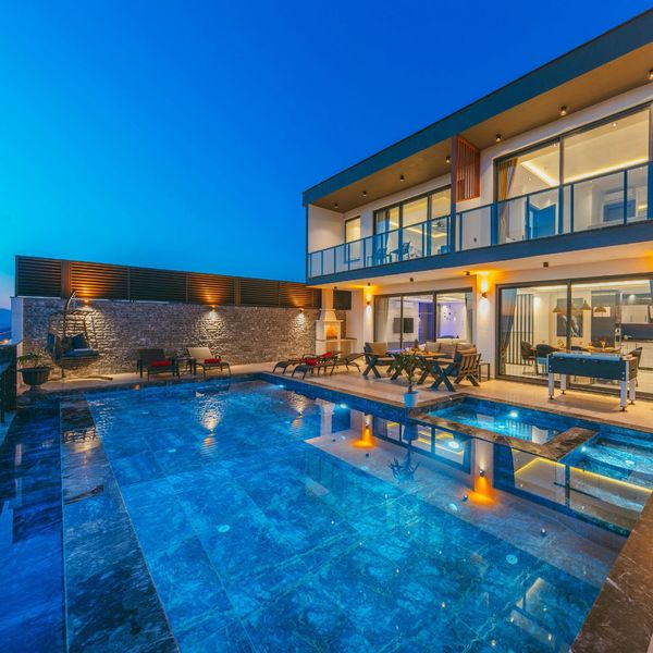 modern pool at night with lights inside modern pool at night with lights inside