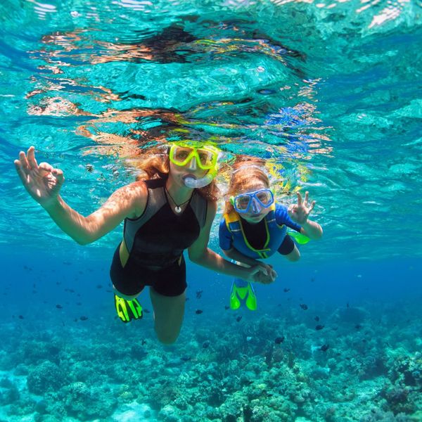 mom and daughter snorkeling