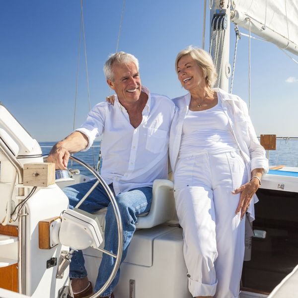 mature couple enjoying boat ride