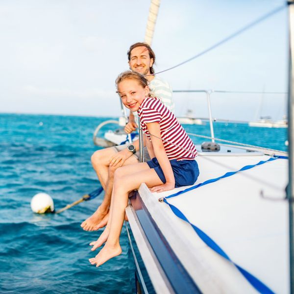 father and daughter on sailboat