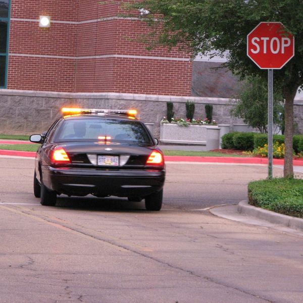 Security car at a stop sign