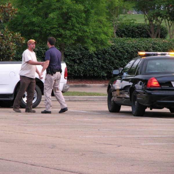 On-site security shaking hands with a civilian