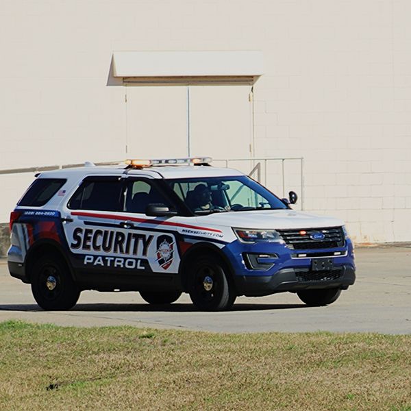 Security car driving around a building