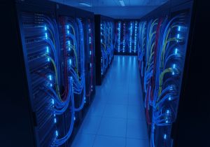 Professional organized server rack with glowing blue network cables representing turn-key security infrastructure. Professional organized server rack with glowing blue network cables representing turn-key security infrastructure.