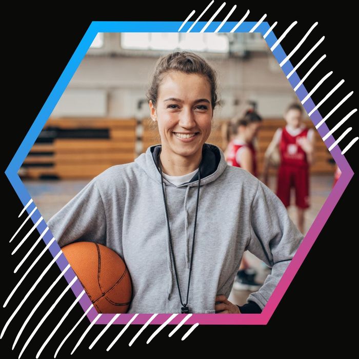 Basketball coach smiling on the court