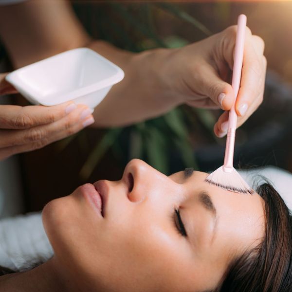 woman receiving chemical peel treatment