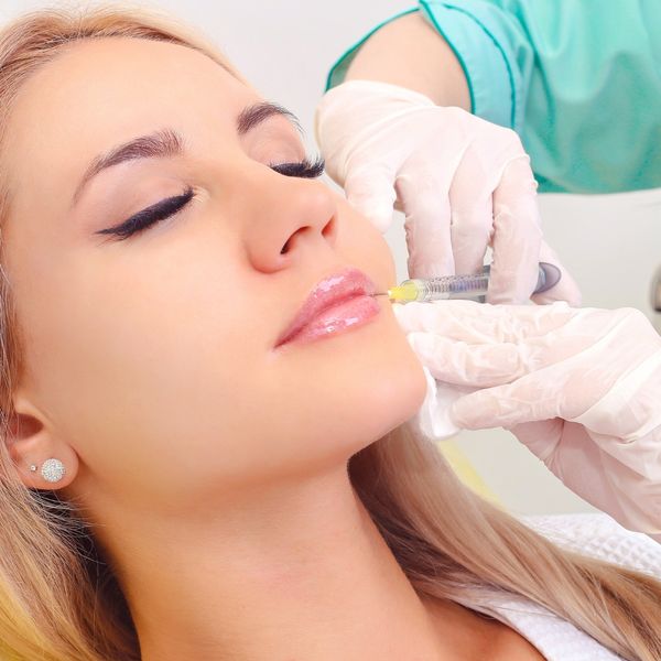 Woman getting lip fillers