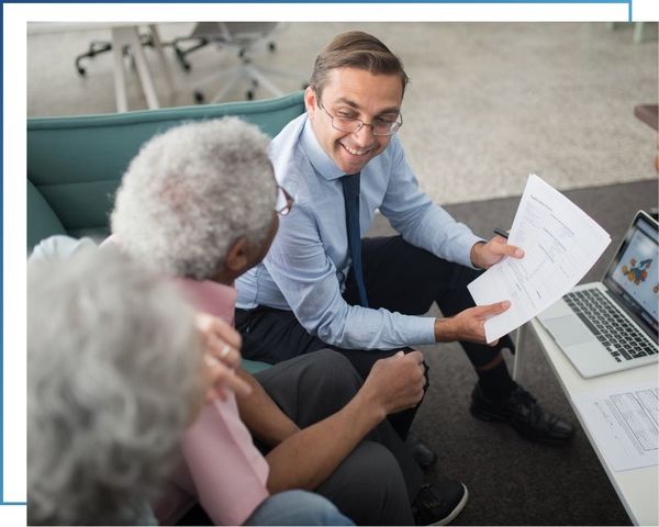 insurance agent working with older couple