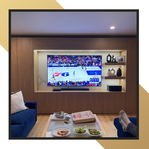 Modern living space with the 76ers on TV