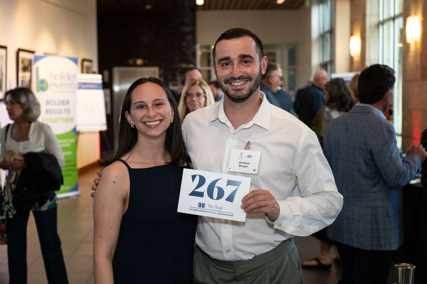 Guests posing with paddle number