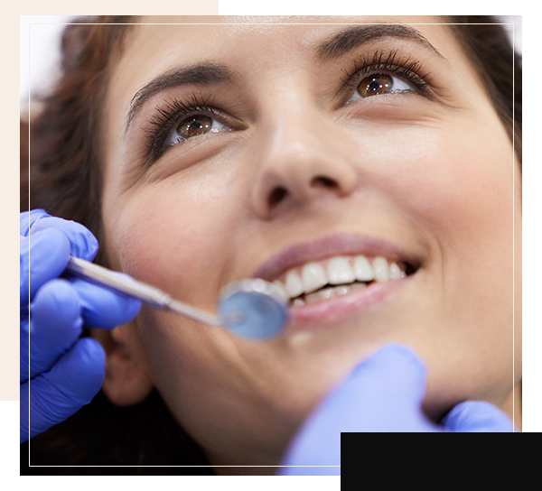 Woman getting her teeth checked at dentist