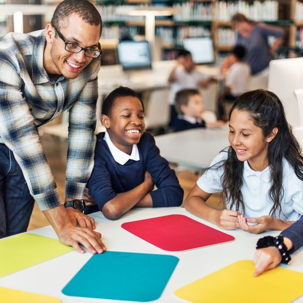Kids smiling at school with instructor