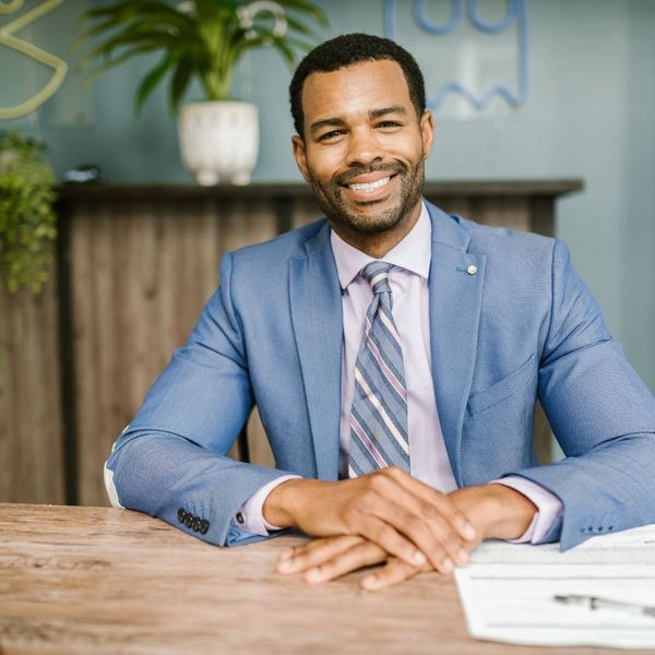 man smiling confidently man smiling confidently